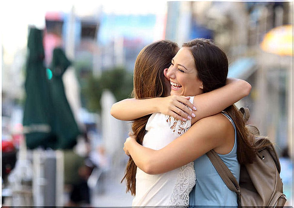 Hug between two women