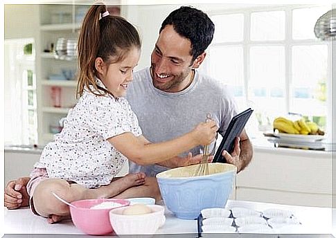 Father and daughter cook together