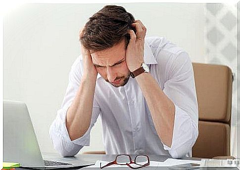 Boy at the computer with migraine