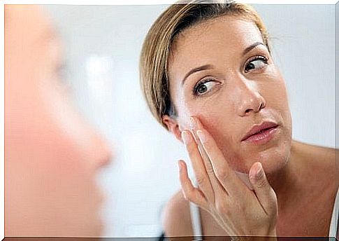 Woman looking in the mirror pineapple mask