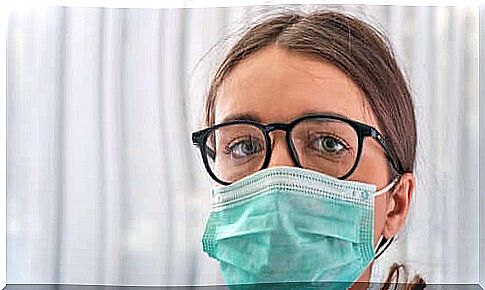 Girl with eyeglasses and surgical mask