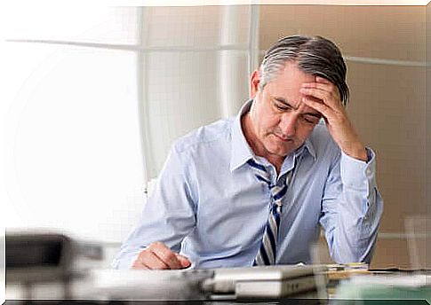 Man sitting on desk reflecting