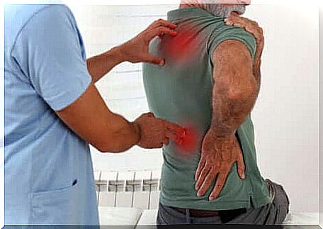 Man with back pain at the physiotherapist.