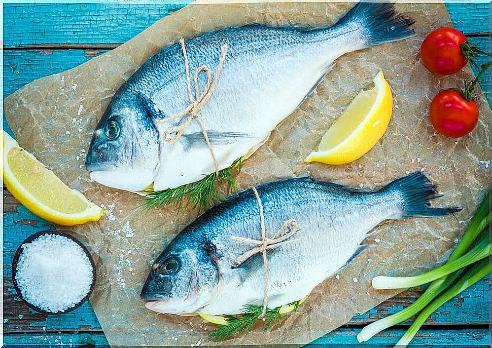 Blue fish with cherry tomatoes and lemon